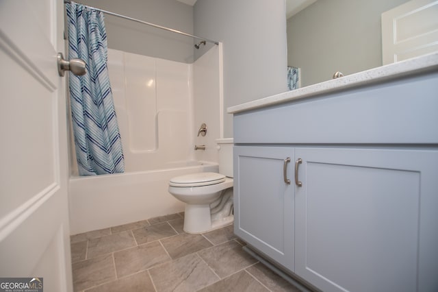 full bathroom with tile patterned flooring, toilet, shower / bathtub combination with curtain, and vanity