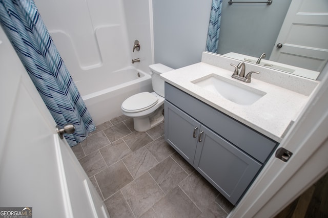 full bathroom featuring toilet, shower / tub combo with curtain, tile patterned floors, and vanity