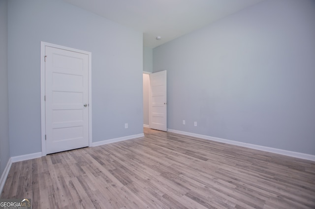 unfurnished room with light hardwood / wood-style flooring