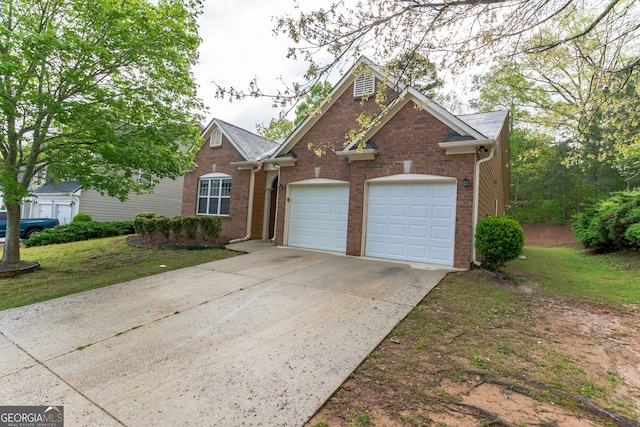 view of front facade with a front lawn and a garage