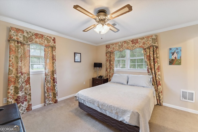 bedroom with light colored carpet, multiple windows, and ceiling fan