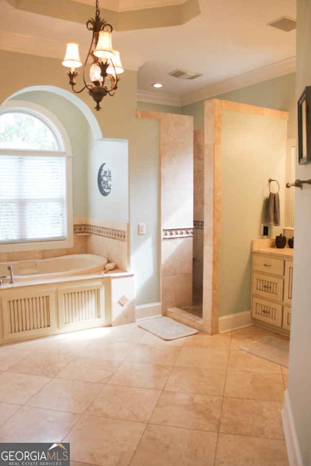 bathroom featuring an inviting chandelier, tile patterned flooring, vanity, and separate shower and tub