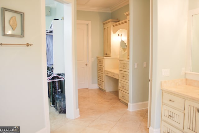 bathroom featuring vanity, tile patterned floors, and crown molding