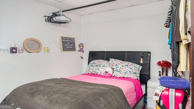 bedroom with a drop ceiling