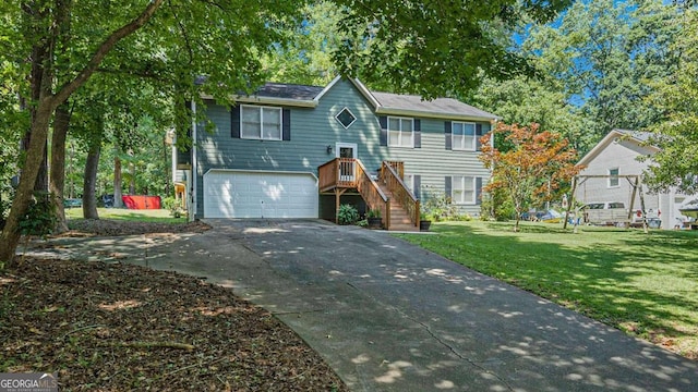 view of front of home with a garage and a front yard