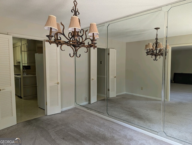 interior space featuring carpet floors, a textured ceiling, sink, and a chandelier