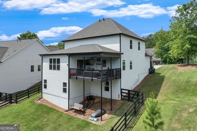 back of house with a yard