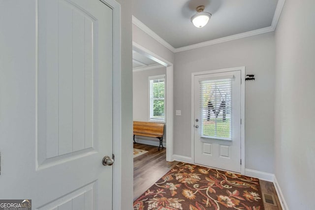 entryway with hardwood / wood-style floors and ornamental molding