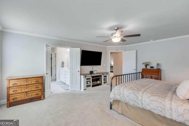 bedroom featuring ceiling fan, ornamental molding, and light colored carpet