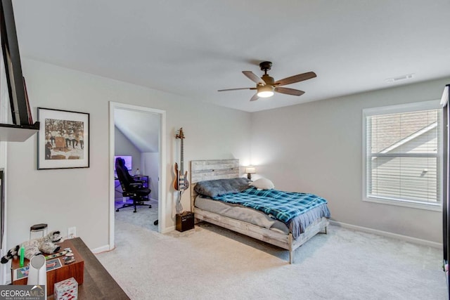 bedroom featuring ceiling fan and light carpet