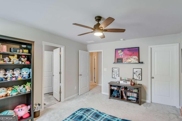 carpeted bedroom featuring ceiling fan