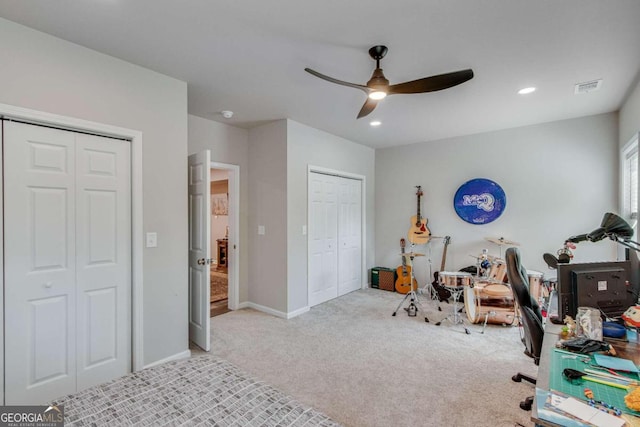 playroom featuring ceiling fan and light carpet