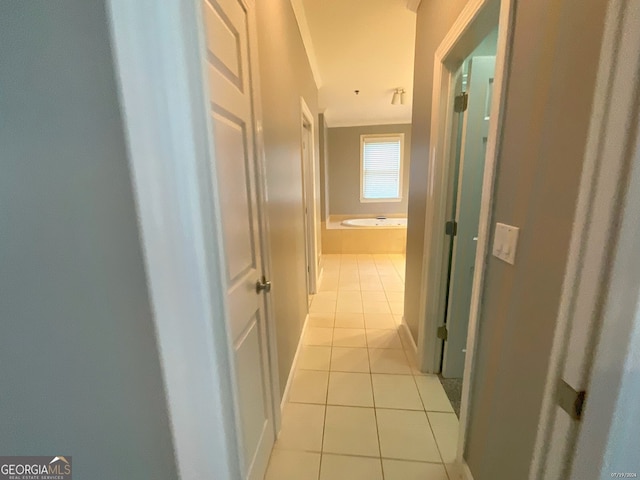 corridor featuring light tile patterned floors