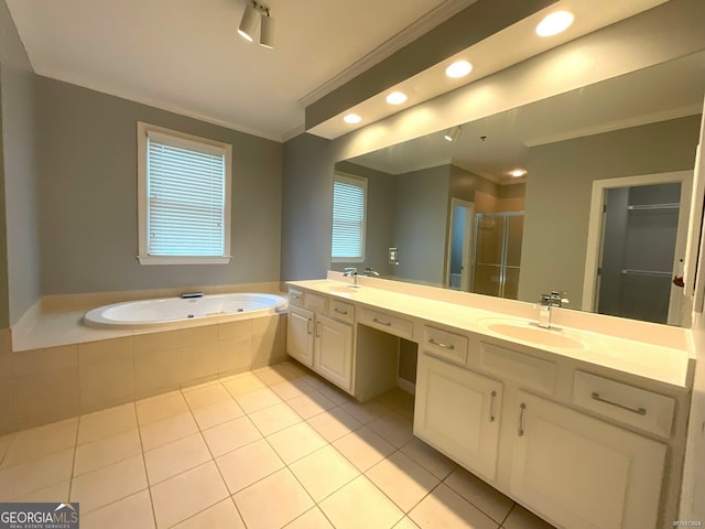 bathroom with tile patterned flooring, independent shower and bath, ornamental molding, and double sink vanity