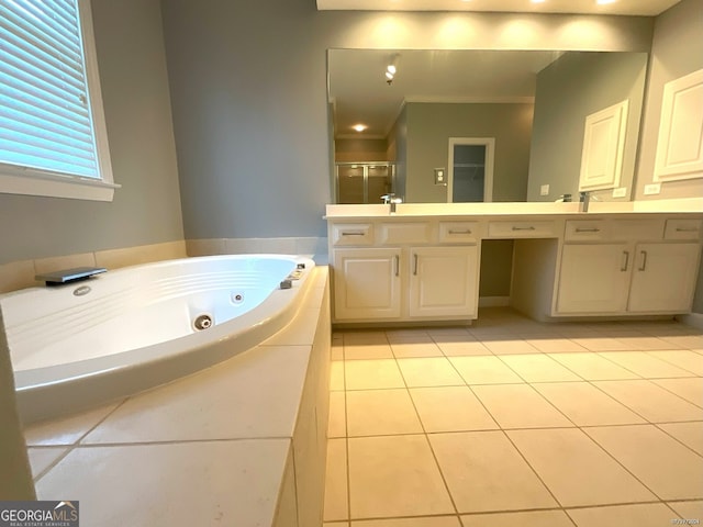 bathroom with crown molding, a tub to relax in, double vanity, and tile patterned flooring