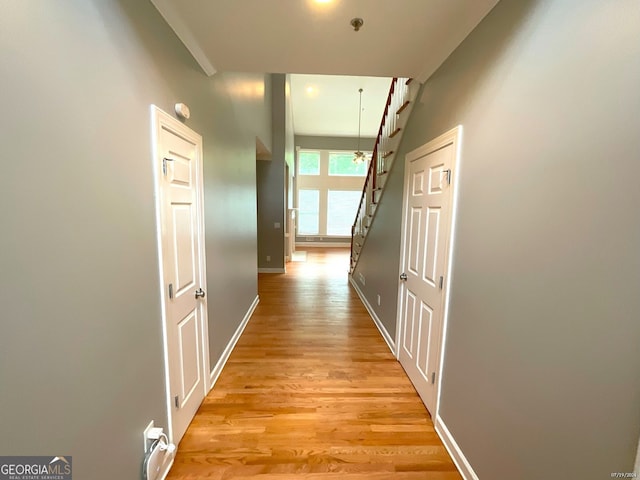 hallway with light wood-type flooring