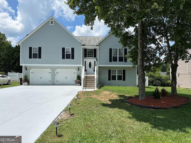 bi-level home featuring a front yard and a garage