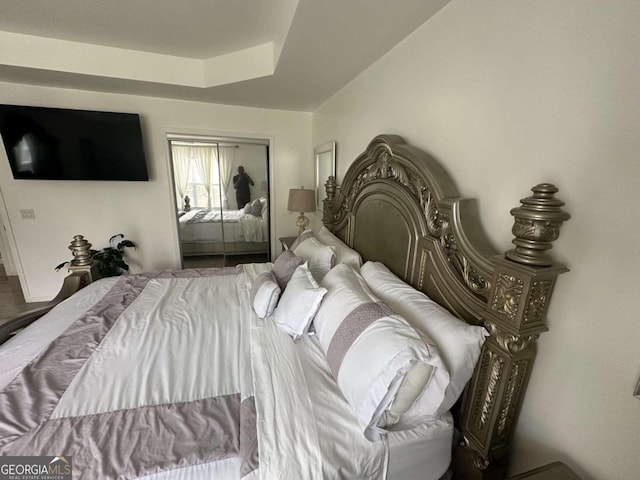 bedroom with a tray ceiling