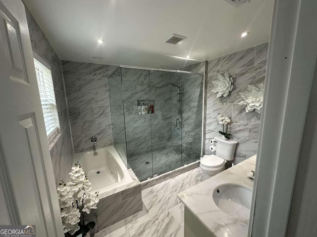 bathroom with tile patterned flooring, tile walls, toilet, and vanity