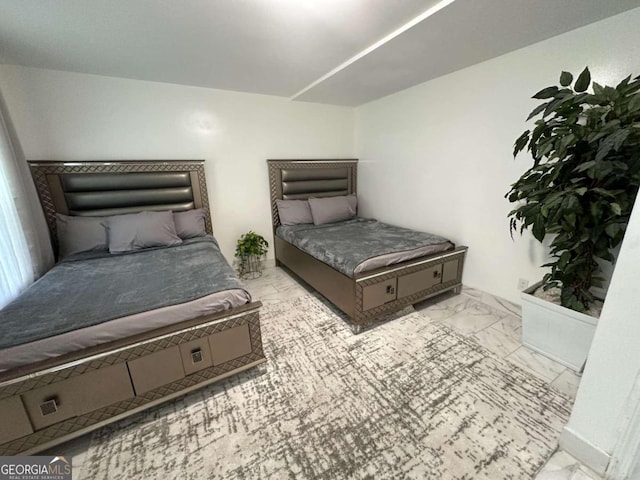 bedroom with light tile patterned floors