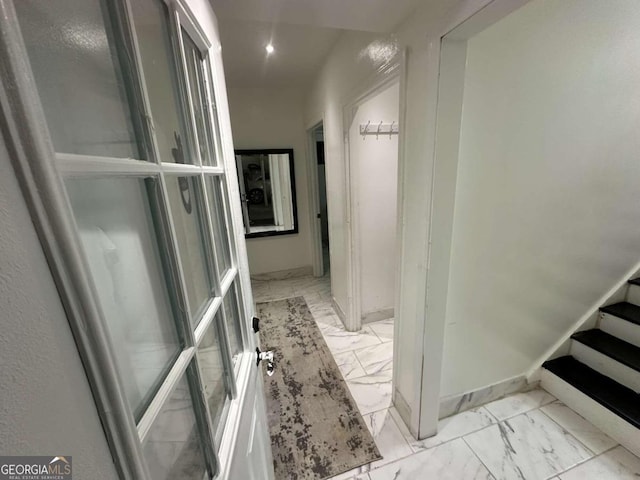 hallway featuring light tile patterned floors