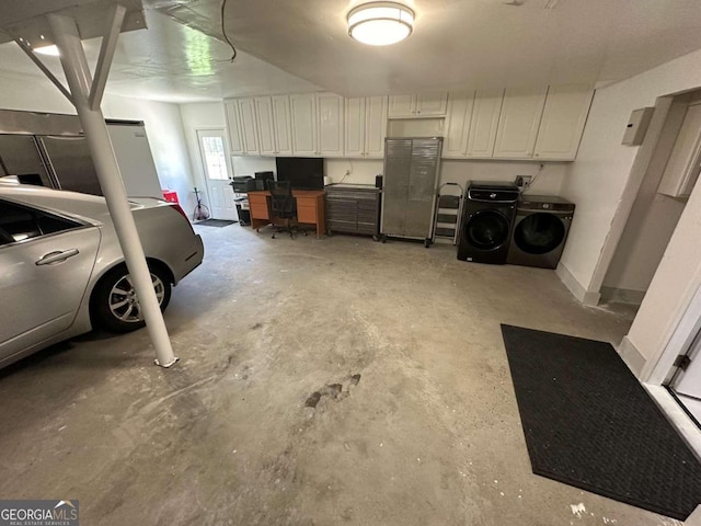 garage featuring independent washer and dryer