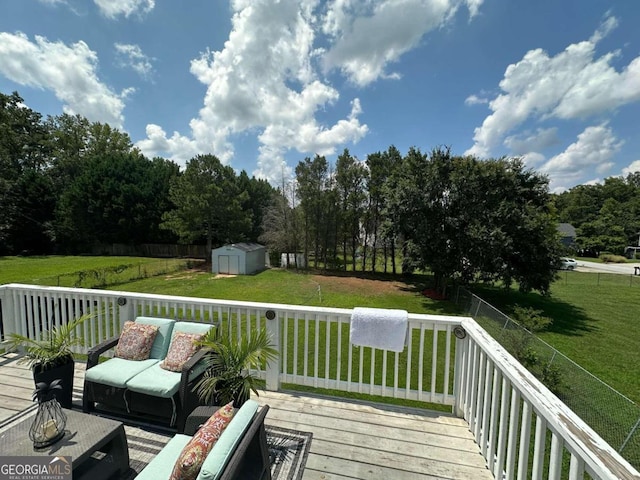 wooden deck featuring outdoor lounge area, a shed, and a lawn