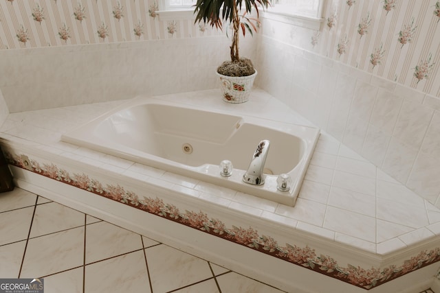 bathroom featuring tiled bath and tile patterned flooring