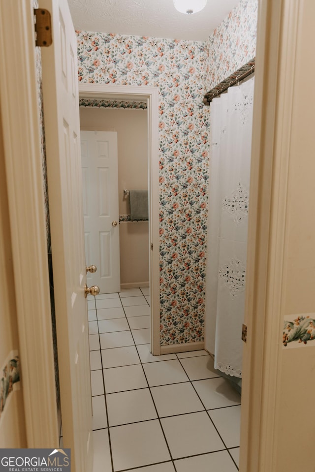 bathroom with tile patterned flooring