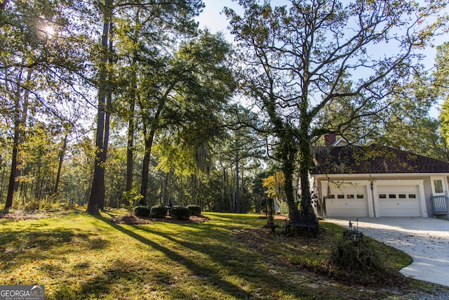 view of yard with a garage