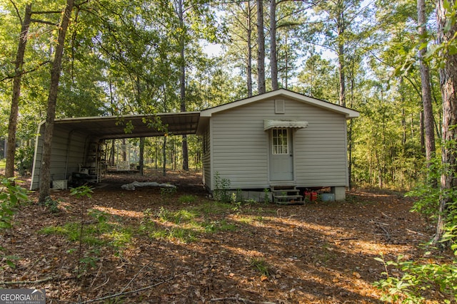 view of outbuilding with a carport