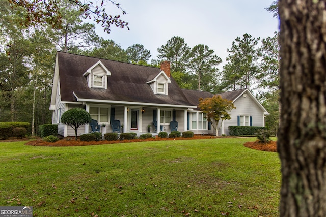 cape cod house with a porch and a front lawn