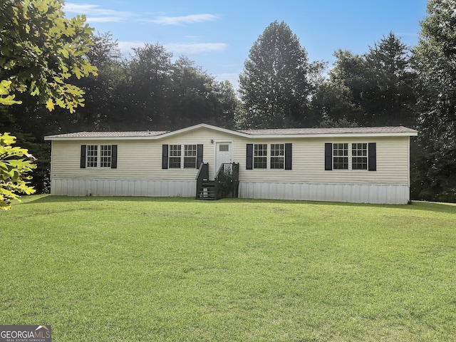 manufactured / mobile home with a front lawn