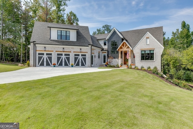 view of front of property featuring a garage and a front lawn