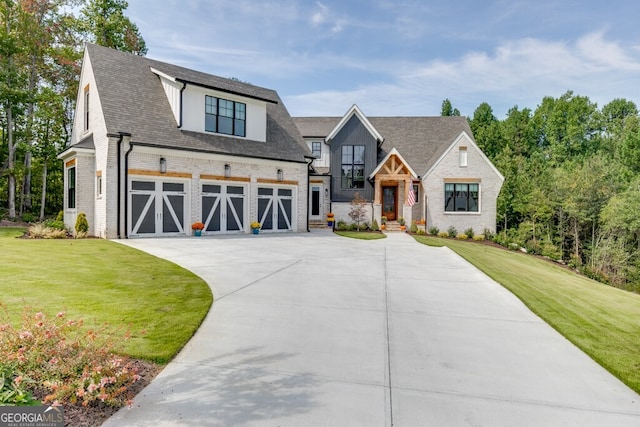 view of front of property with a garage and a front lawn