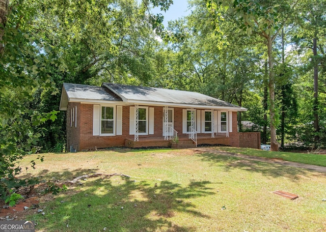 single story home with a porch and a front lawn