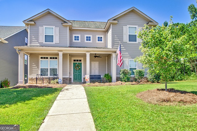 view of front of home with a front lawn and covered porch