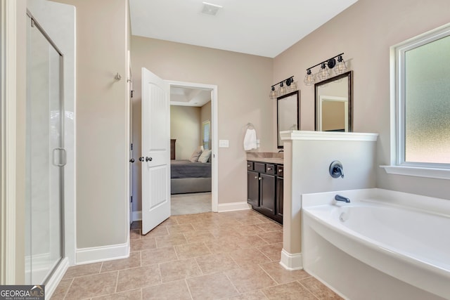 bathroom with tile patterned floors, shower with separate bathtub, and vanity