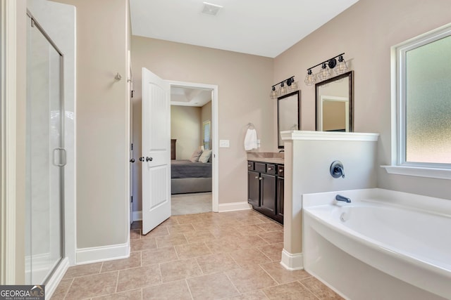 bathroom with visible vents, ensuite bath, a garden tub, vanity, and a shower stall