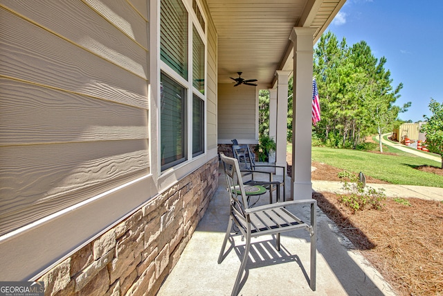 view of patio featuring ceiling fan and a playground