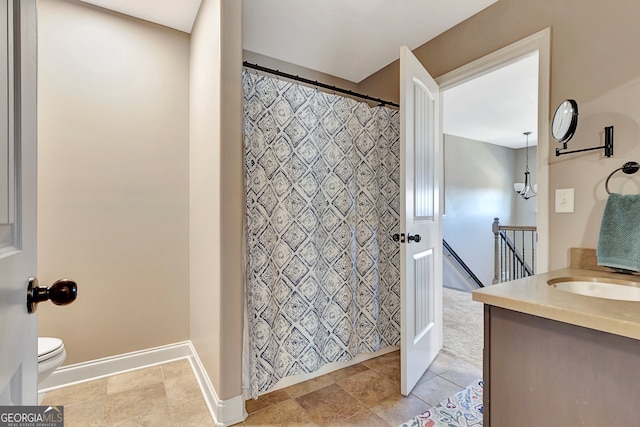 bathroom with tile patterned floors, vanity, and toilet