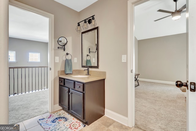 bathroom with ceiling fan, tile patterned floors, and vanity