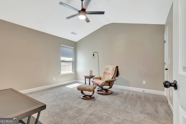 sitting room featuring ceiling fan, vaulted ceiling, and light carpet