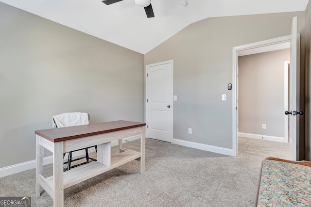 carpeted home office featuring ceiling fan and lofted ceiling