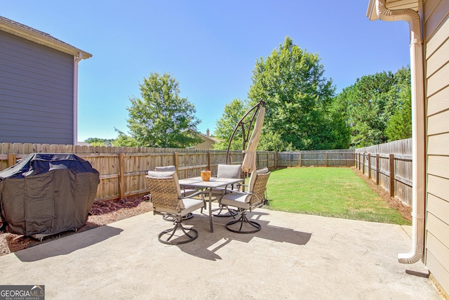 view of patio / terrace featuring outdoor dining area, a fenced backyard, and area for grilling