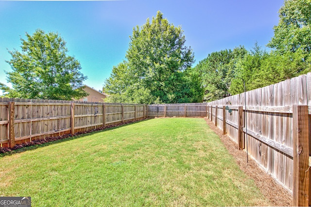 view of yard featuring a fenced backyard