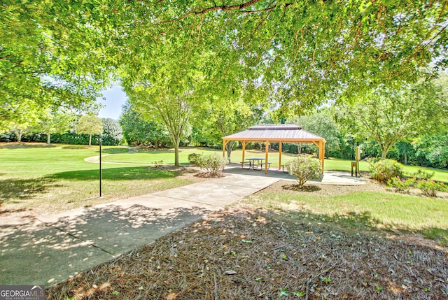 view of community with a gazebo and a lawn