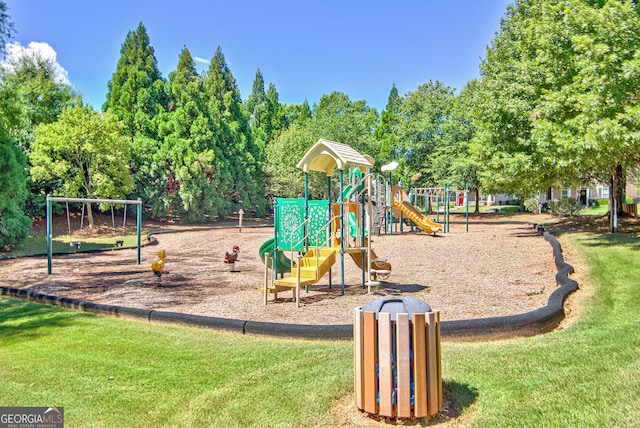 view of playground with a lawn