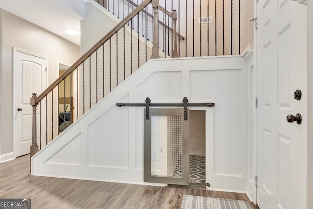 stairs featuring wood finished floors