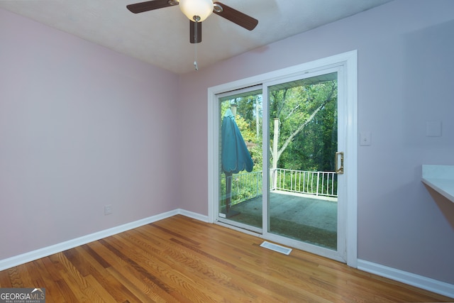 spare room featuring ceiling fan and light wood-type flooring